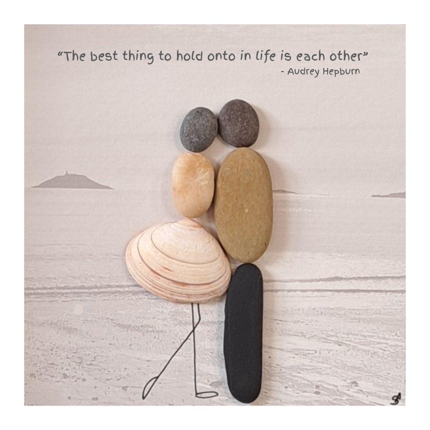 Two stone figures holding hands with a quote by Audrey Hepburn on a light beach scene background